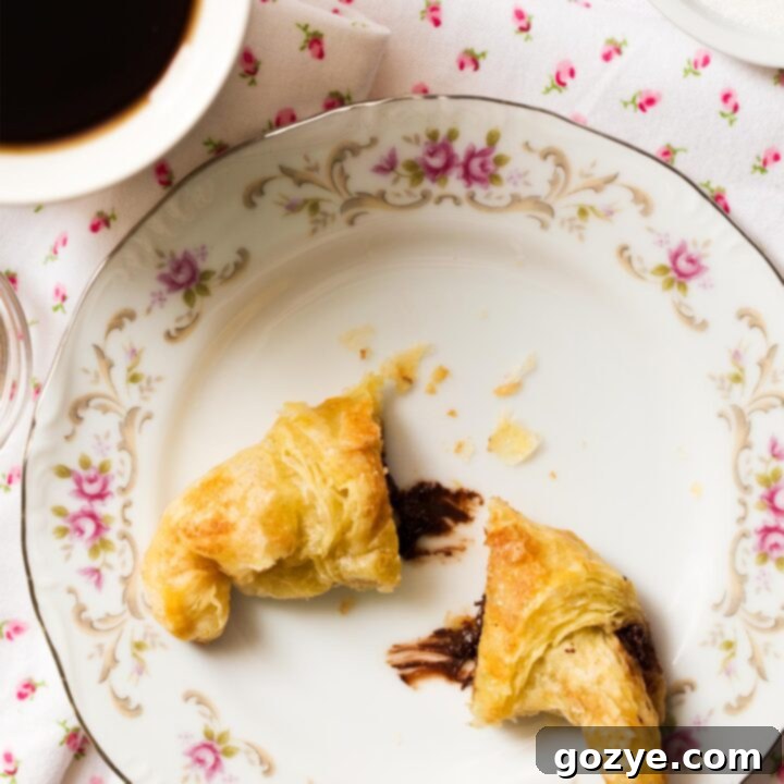 Close up of Puff Pastry Chocolate Croissants on pretty flower plate