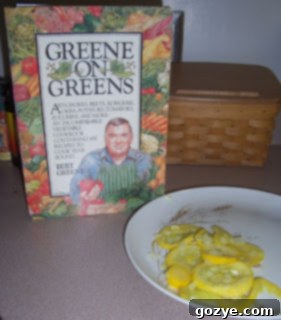 A freshly cooked plate of pan-fried summer squash, garnished with herbs.