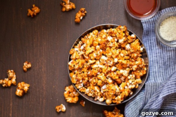 Close-up of Buffalo Ranch Caramel Popcorn with shiny caramel coating and seasoning