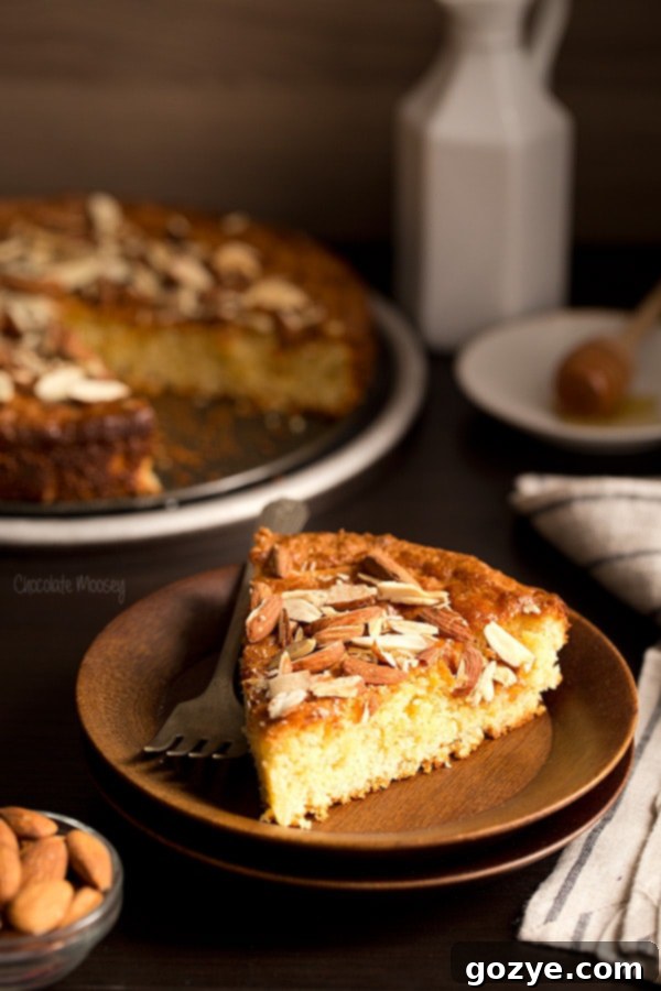Honeyed Almond Vanilla Delight 4 A slice of Vanilla Honey Almond Cake, showcasing its moist texture and almond topping
