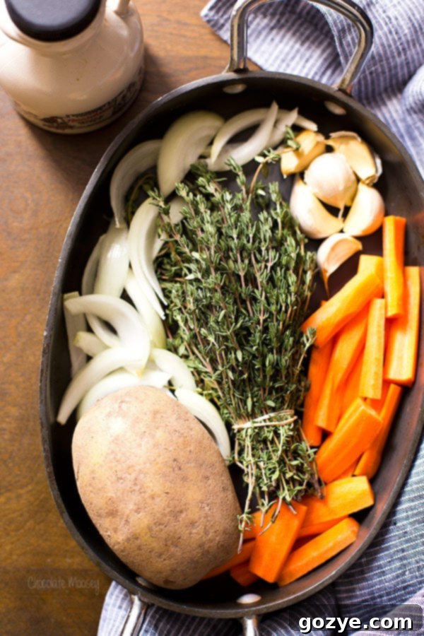 Raw ingredients for maple roasted chicken quarters in a roasting pan