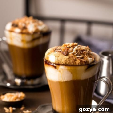 Toasted Coconut Mocha with whipped cream and toasted coconut flakes, ready to be served.