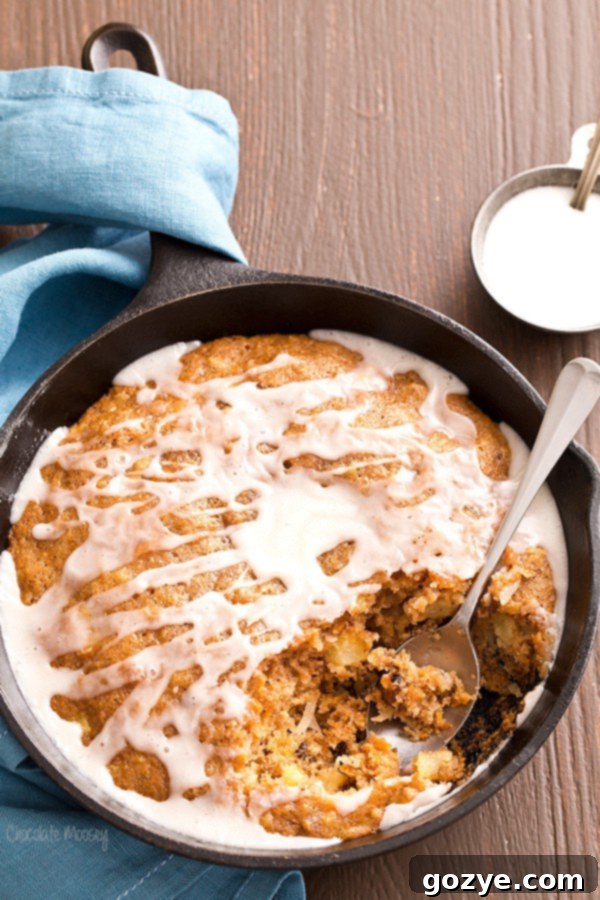 Moist one-layer Carrot Cake Skillet Cake with a generous drizzle of homemade vanilla glaze.
