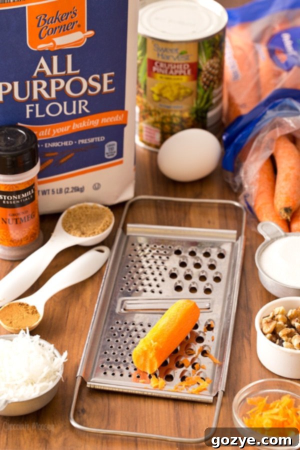 A collection of fresh baking ingredients for Carrot Cake Skillet Cake, including carrots, flour, and spices.