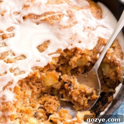 Carrot Cake Skillet Cake topped with vanilla glaze, a perfect quick dessert.