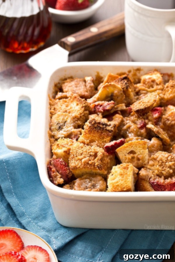 Close-up of the delicious Strawberry Banana French Toast Bake with its crispy topping