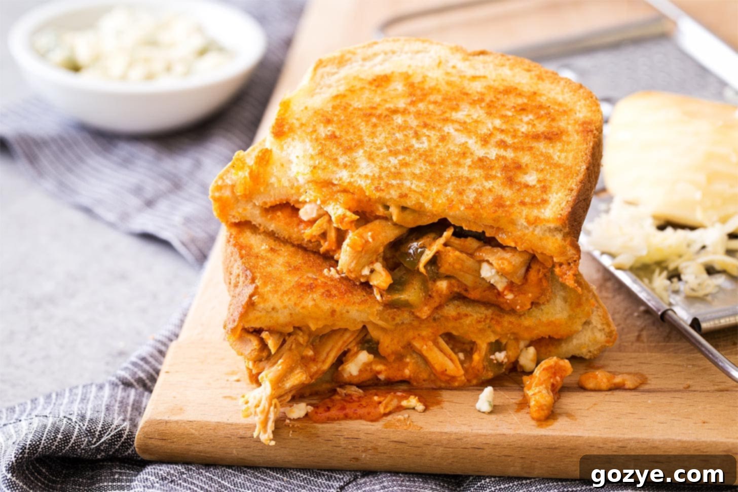 Buffalo Chicken Melt on a cutting board