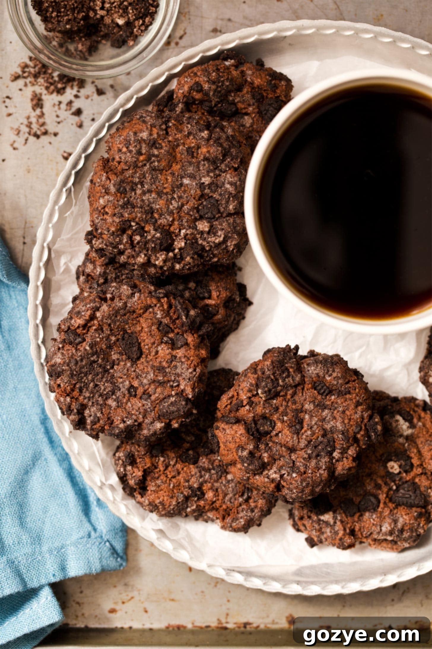 Plate of chocolate cream cheese cookies served with a cup of coffee