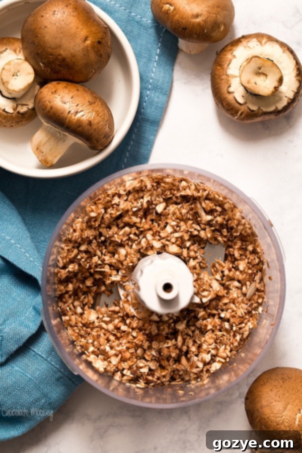 Finely chopping cremini mushrooms for Greek Baked Eggs