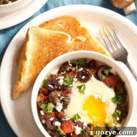 Greek Baked Eggs with Lamb and Mushrooms recipe card image