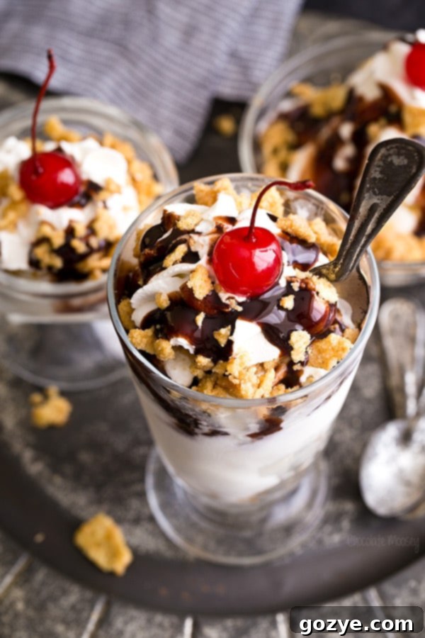 Close-up of a Fried Ice Cream Sundae with a spoon, showing layers of cereal and ice cream