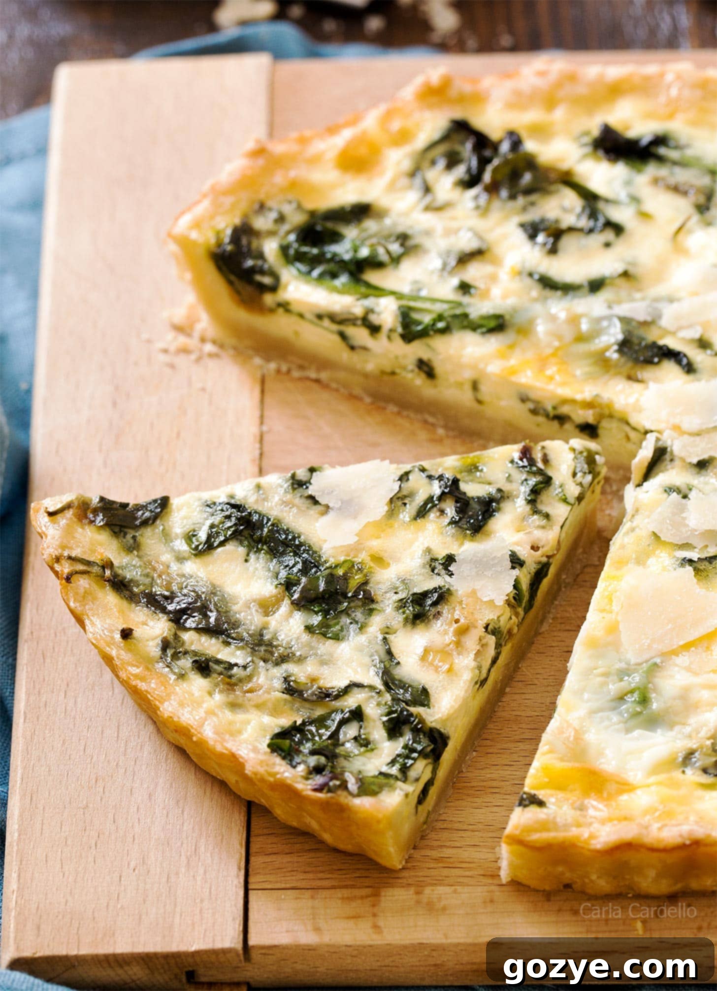 Close up slice of Quiche Florentine with flaky crust