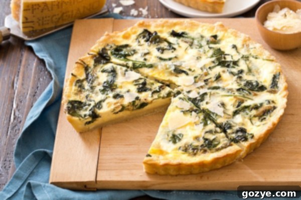 Slice of Spinach Quiche with a crisp crust