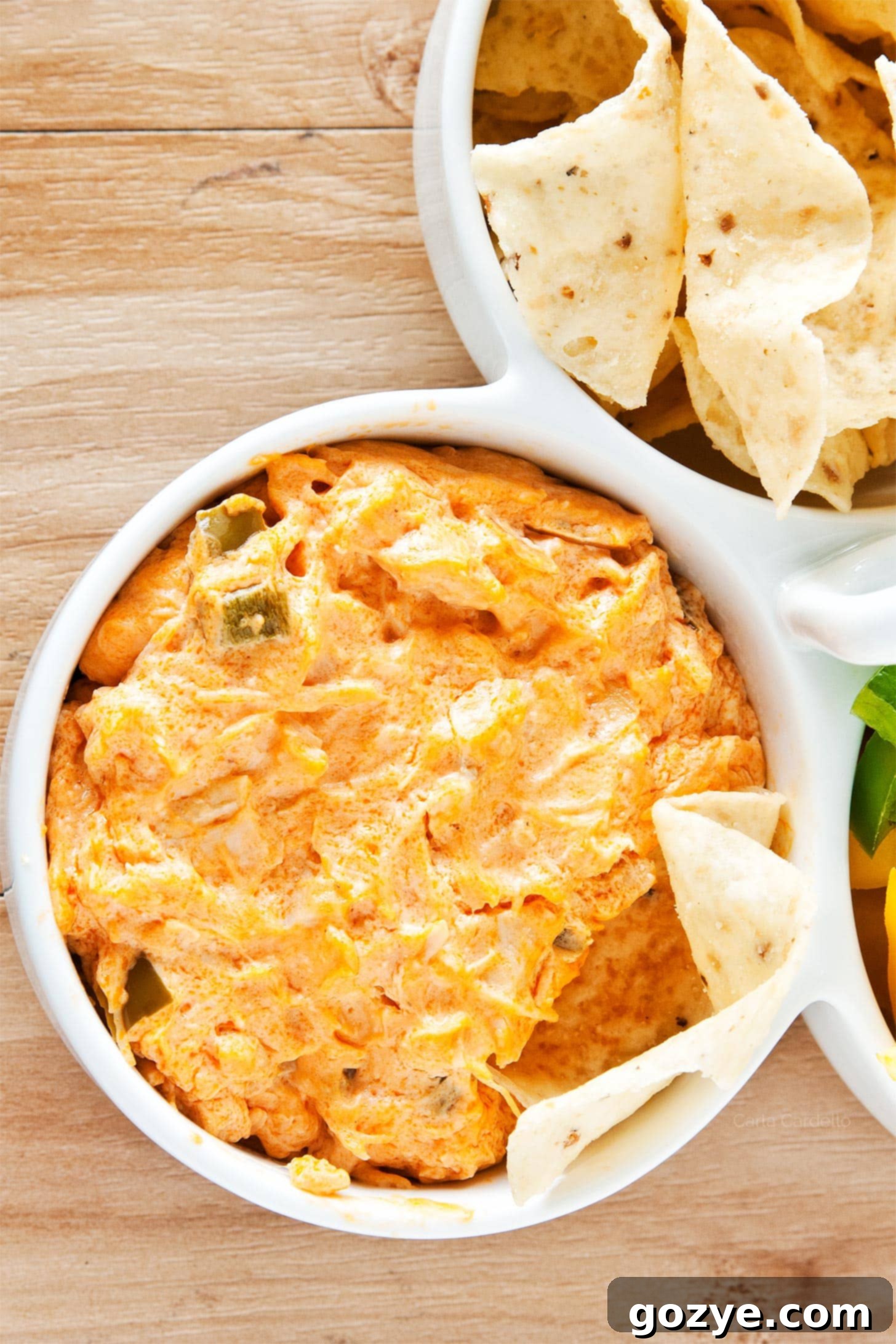 Irresistible Buffalo Chicken Dip 2 Buffalo Chicken Dip in a white bowl, ready to be served at a party