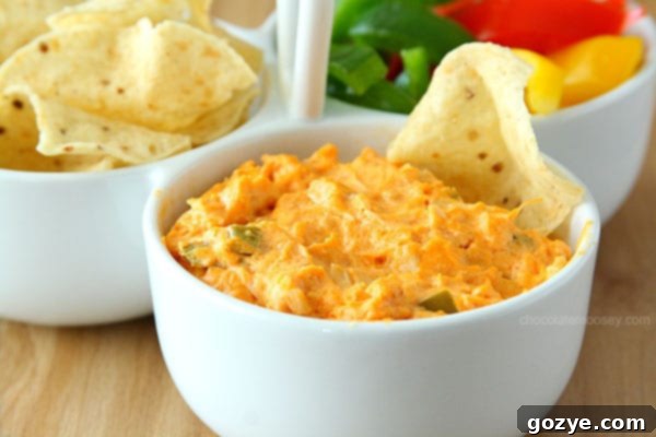 Irresistible Buffalo Chicken Dip 4 Close-up of bubbling Buffalo Chicken Dip, showcasing its cheesy texture for an easy party food