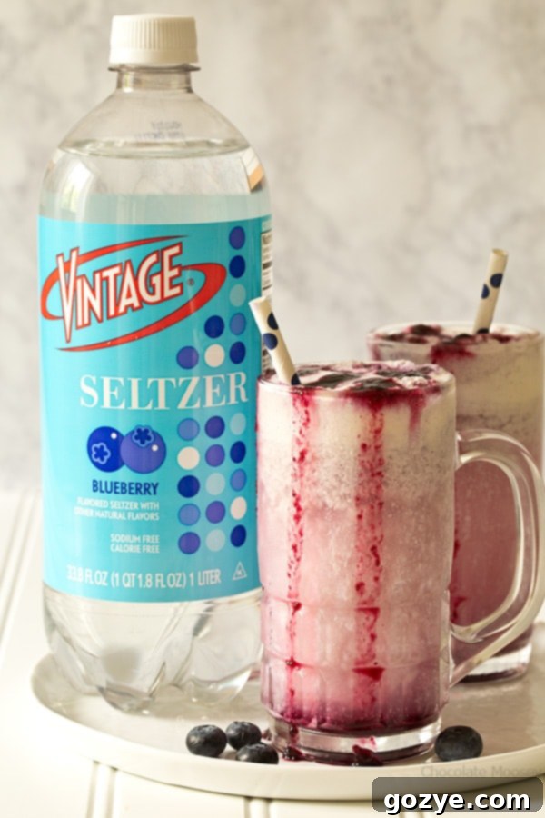 Enjoy summer in a glass with Blueberry Cream Soda Floats made with homemade blueberry soda and vanilla ice cream.