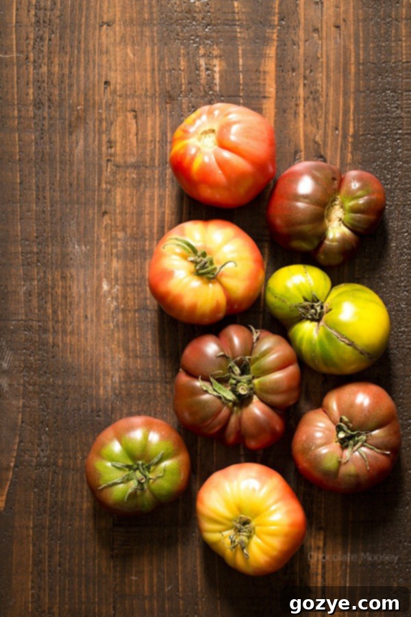 Assortment of colorful heirloom tomatoes, ideal for making rich, flavorful homemade tomato soup.