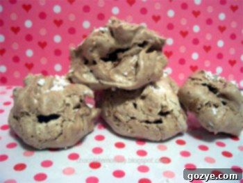 Delicate Cocoa Almond Meringues arranged beautifully on a serving dish, highlighting their light and crispy texture.