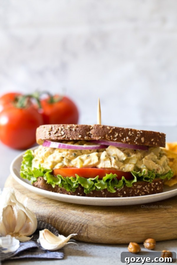 Delicious Garlic Hummus Chicken Salad Sandwiches, perfectly arranged for a quick, healthy lunch or dinner. Features a creamy garlic hummus spread for a unique flavor.
