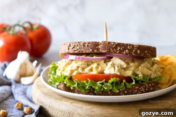 Close-up of the creamy Garlic Hummus Chicken Salad, showcasing its rich texture, vibrant colors, and flavorful ingredients like relish and onion.