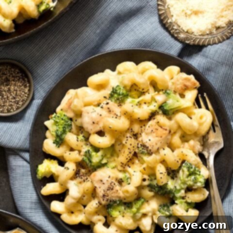 The Ultimate Alfredo Mac and Cheese 5 Alfredo mac and cheese on black plate with fork