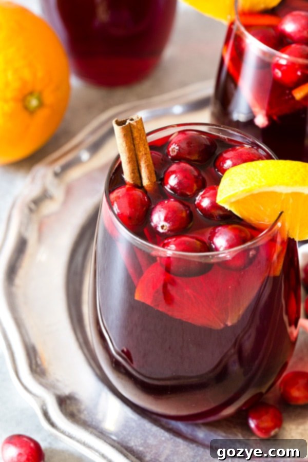 Make your next holiday cocktail an easy one with Cranberry Orange Sangria made with red wine, cranberry juice, and oranges.
