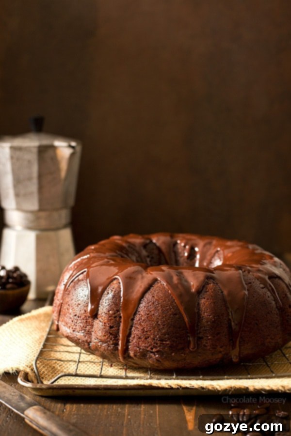 Close-up of a slice of moist Chocolate Mocha Pumpkin Bundt Cake with ganache glaze