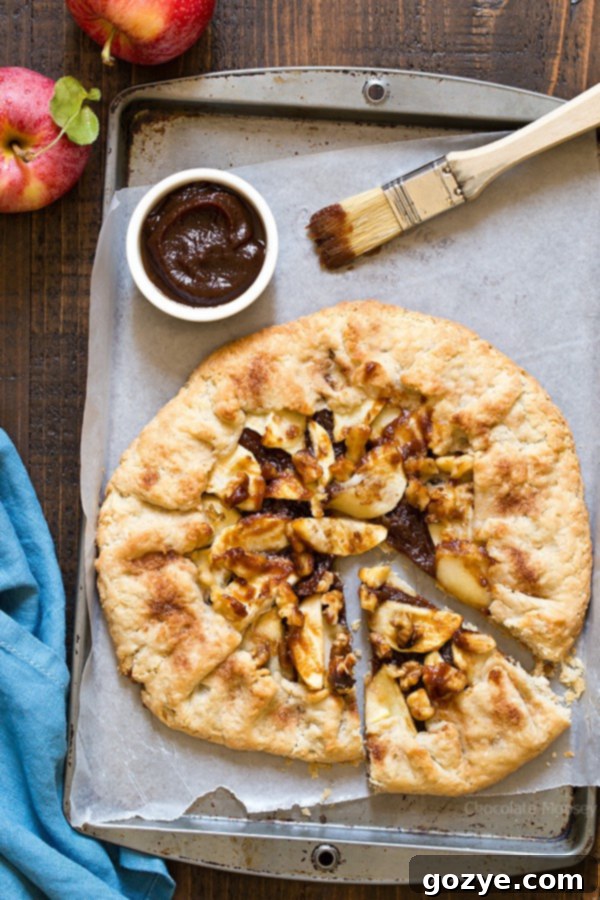 Easier than pie! Apple Butter Galette is an open-faced pie made with homemade pie crust, apple butter, fresh apple slices, and walnuts. 