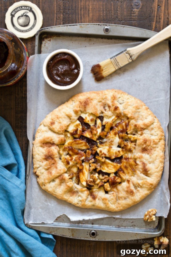 Easier than pie! Apple Butter Galette is an open-faced pie made with homemade pie crust, apple butter, fresh apple slices, and walnuts.