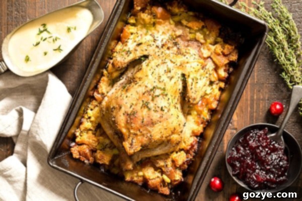 Cornish hen in roasting pan with stuffing