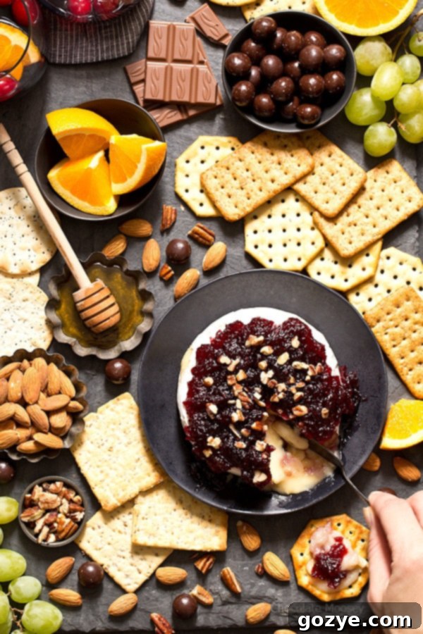 Cranberry Baked Brie on a slate cheese board