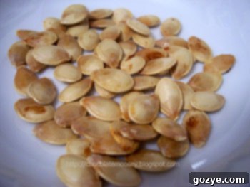 Roasted spaghetti squash seeds on a baking sheet