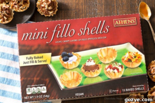 Mini No Bake Turtle Cheesecake Phyllo Cups 4 A selection of mini No-Bake Turtle Cheesecake Phyllo Cups arranged on a serving plate.