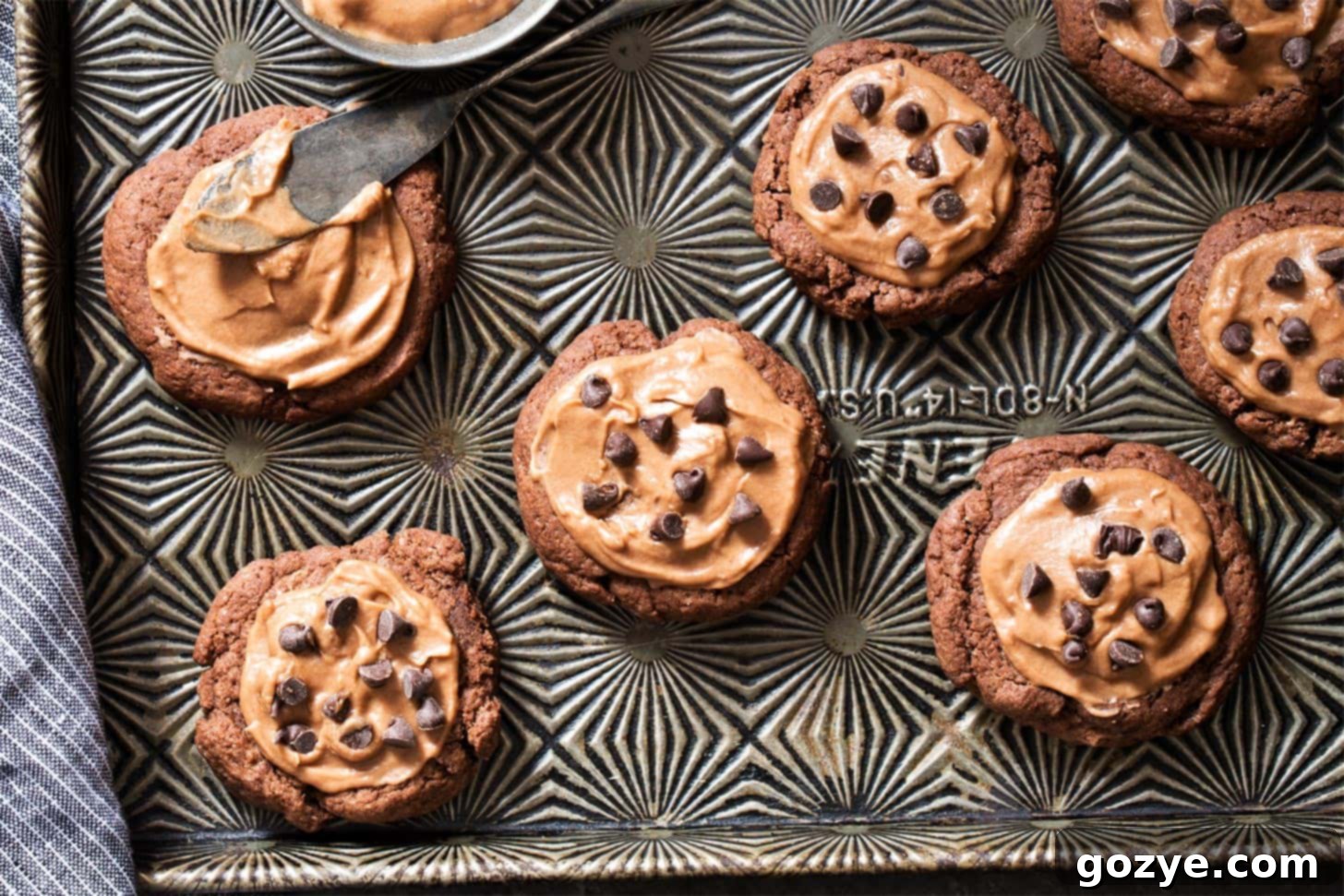A tray of un-frosted chocolate sugar cookies, showing their perfect round shape and soft texture