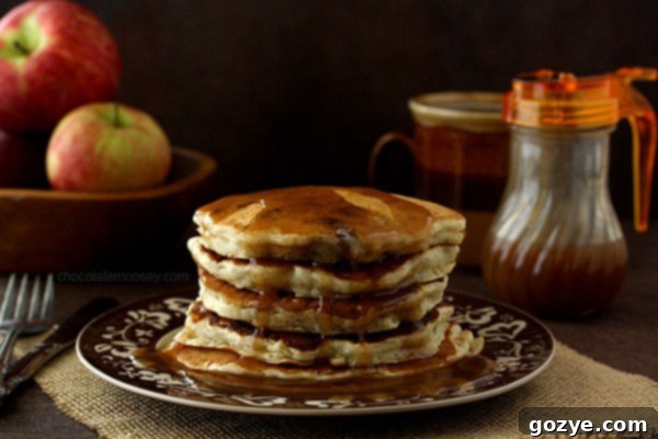 Ingredients for Apple Cider Syrup laid out: apple cider, sugar, spices, and butter.