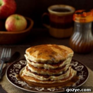 Apple Sausage Pancakes For Two with Apple Cider Syrup, beautifully plated.