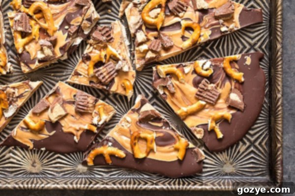 Pretzel bark recipe with chocolate and peanut butter on cookie tray