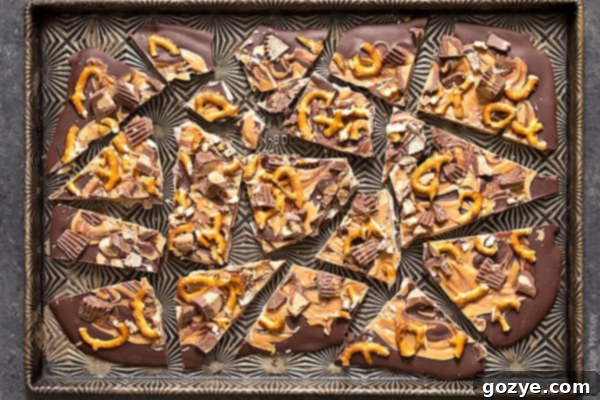 Pretzel bark recipe with chocolate and peanut butter on cookie tray