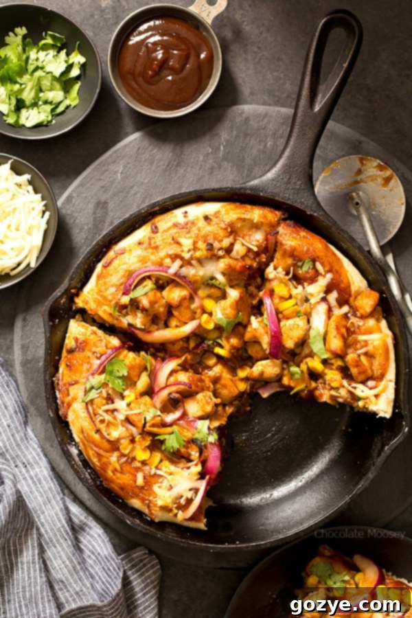 Craft your own delicious BBQ Chicken Skillet Pizza for two at home, easily shaping the dough in a cast iron skillet for a perfect result every time.