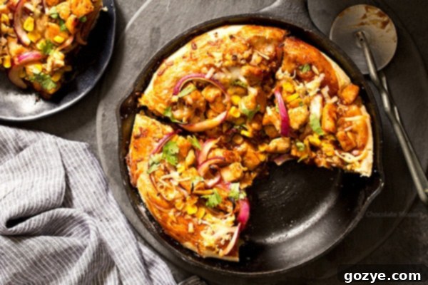 Enjoy the vibrant flavors of BBQ Chicken Skillet Pizza, enhanced by fresh cilantro and a blend of delicious cheeses, all made effortlessly at home.