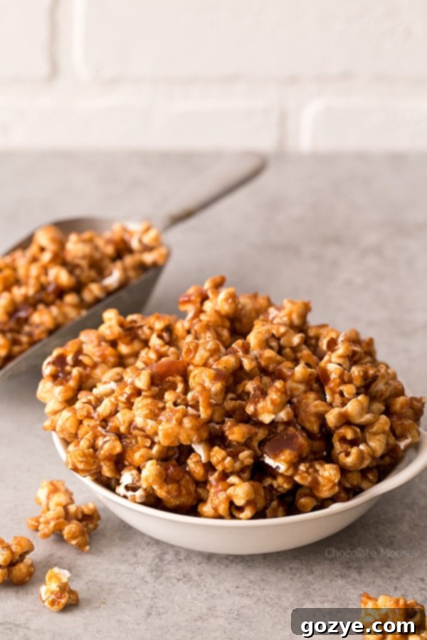 Delicious homemade Caramel Apple Butter Popcorn in a bowl, perfect for cozy evenings.