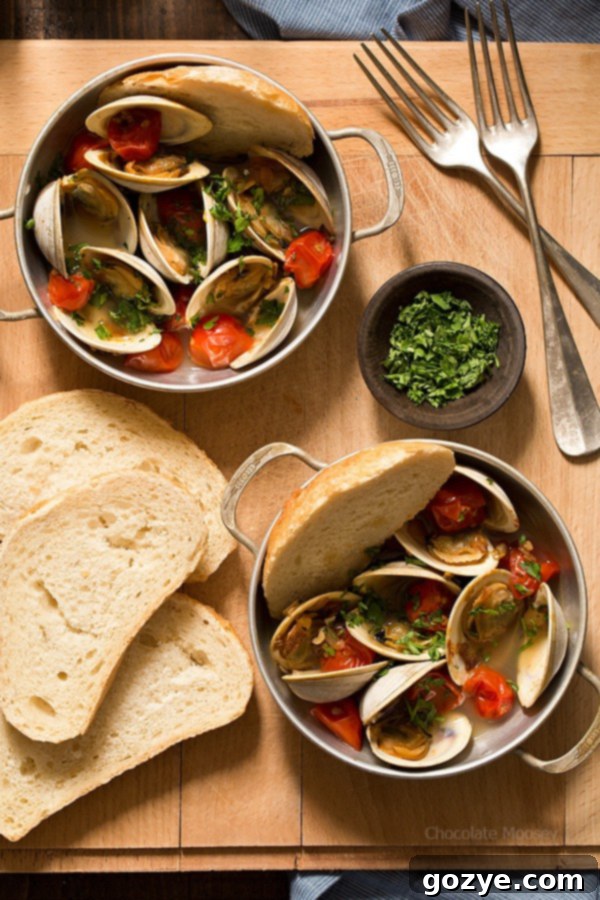 Close-up of fresh littleneck clams, essential for a successful Steamed Clams with Pan-Roasted Tomatoes dish.