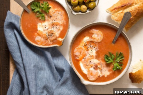 Bloody Mary Tomato Soup with shrimp, showing a close-up of the delicious, creamy texture.
