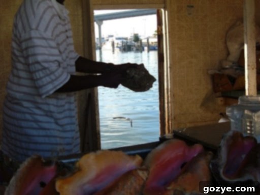 Local preparing fresh conch salad in Nassau, Bahamas
