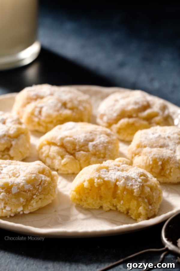 Homemade Peanut Butter Gooey Butter Cookies 5 Freshly baked Peanut Butter Gooey Butter Cookies, light golden brown with a dusting of powdered sugar.