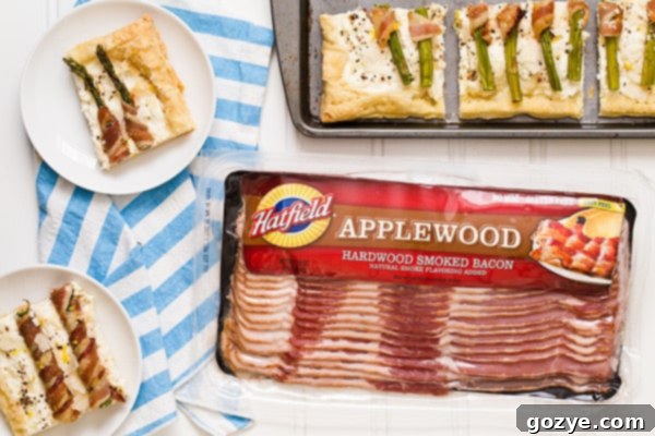 Flaky Asparagus and Bacon Puff Tart 6 A slice of the Bacon Wrapped Asparagus Puff Pastry Tart being served, showcasing the flaky crust and rich filling.