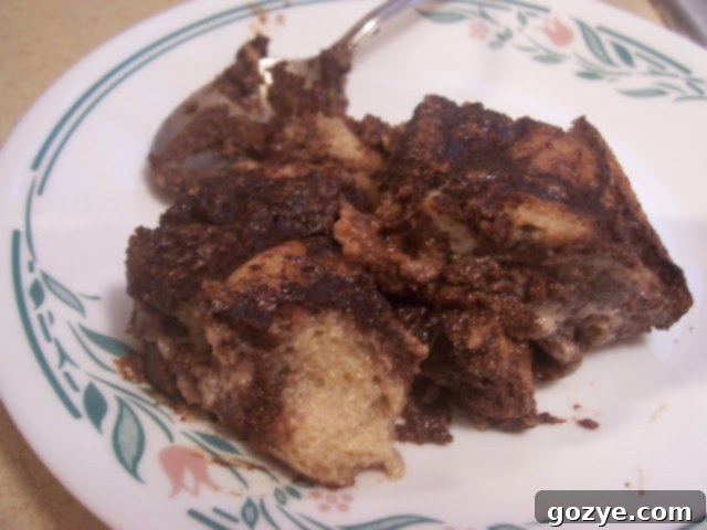 Decadent Chocolate Bread Pudding 2 A beautifully presented slice of Dorie's Chocolate Bread Pudding, perhaps with a dusting of powdered sugar or a dollop of cream.
