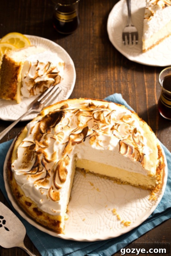 Using a blowtorch to toast the meringue topping on a Lemon Meringue Cheesecake.