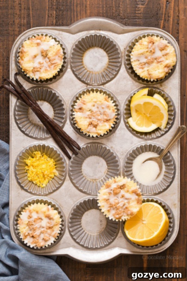 Lemon Crumb Muffins with lemons and vanilla bean in a muffin pan