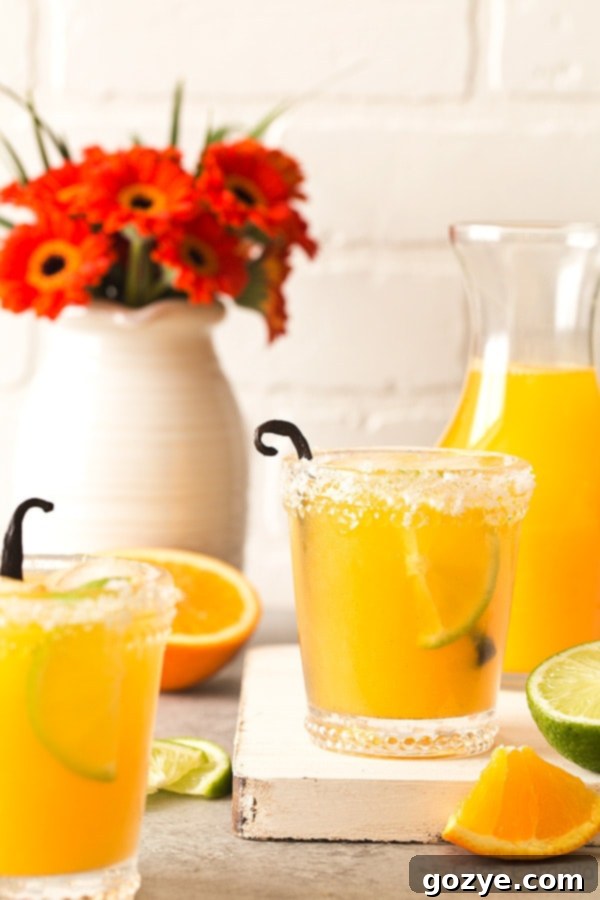 Reminiscent of a creamsicle, these small batch Orange Vanilla Margaritas are made with fresh orange juice, lime juice, and vanilla bean. 